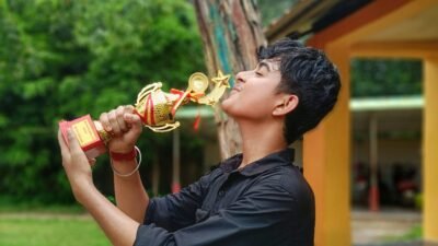 Celebrating victory with a trophy.